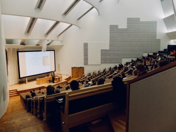 Students in a lecture hall watching a presentation